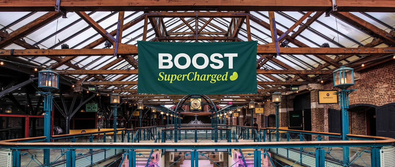 Mezzanine hall with a BOOST SuperCharged banner hanging from the roof trusses